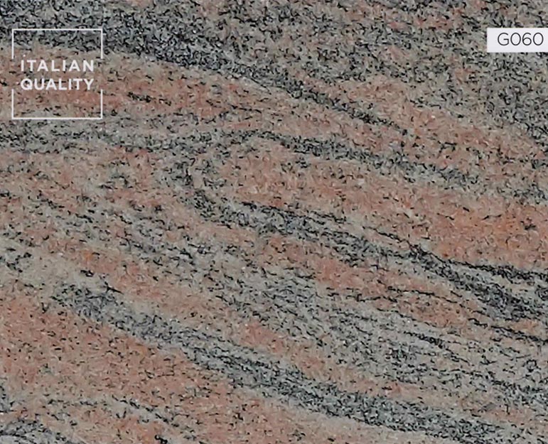G060_Indian-Juparana_Granite Der Indian Juparana Granit ist ein rosafarbener Migmatit aus dem Präkambrium mit kleinen, gefalteten, blaugrauen Bändern. Indian Juparana wird in Indien abgebaut.