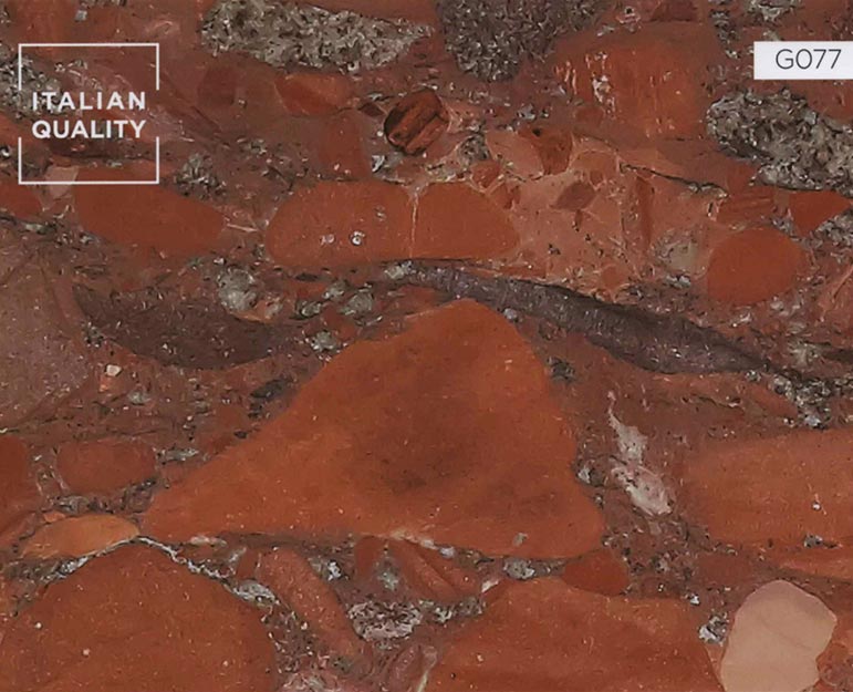 G077_Marinace-Rosso_Granite Der Marinace Rosso Granit ist ein besonders außergewöhnliches Hartgestein mit eingeschlossenen Steinen unterschiedlichster Art, deren Farbnuancen von Orange bis Rot reichen.